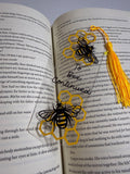 Clear bee and honeycomb bookmark with a yellow tassel
