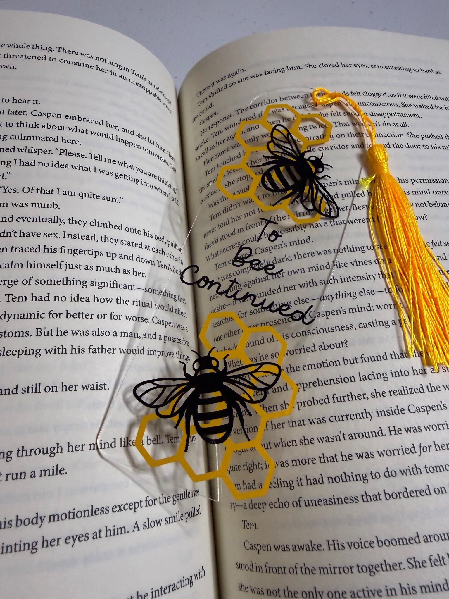 Clear bee and honeycomb bookmark with a yellow tassel