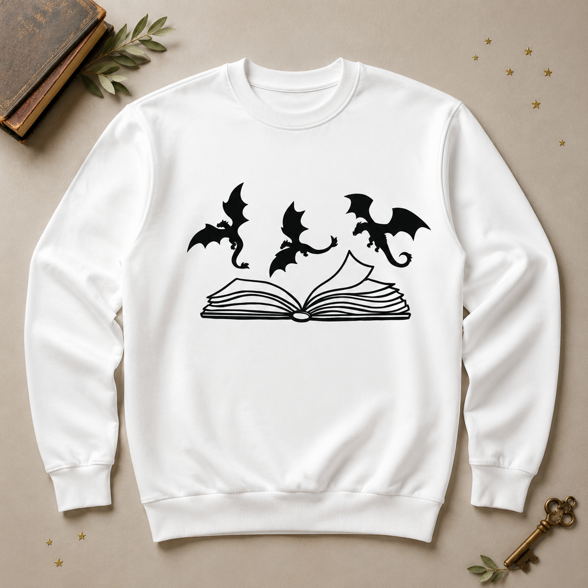 White crewneck sweatshirt with three dragons flying over an open book