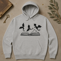 Gray hoodie with three dragons flying over an open book
