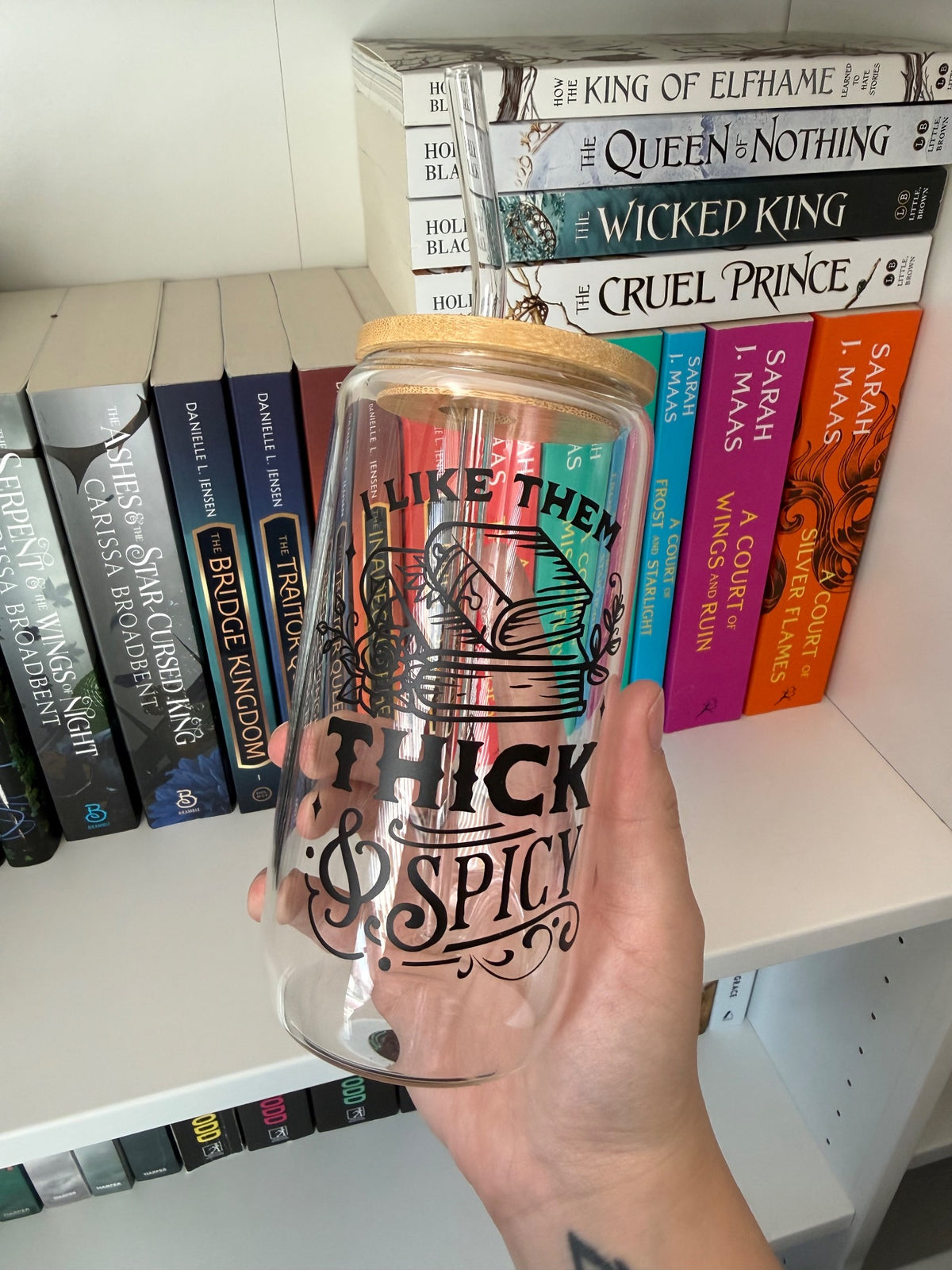 Clear glass tumbler with bamboo lid and an extra-spicy bookish quote