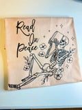 Cream reader T-shirt with Read On Peace skeleton artwork