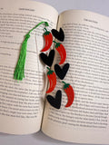 Romance bookmark with red peppers and black hearts